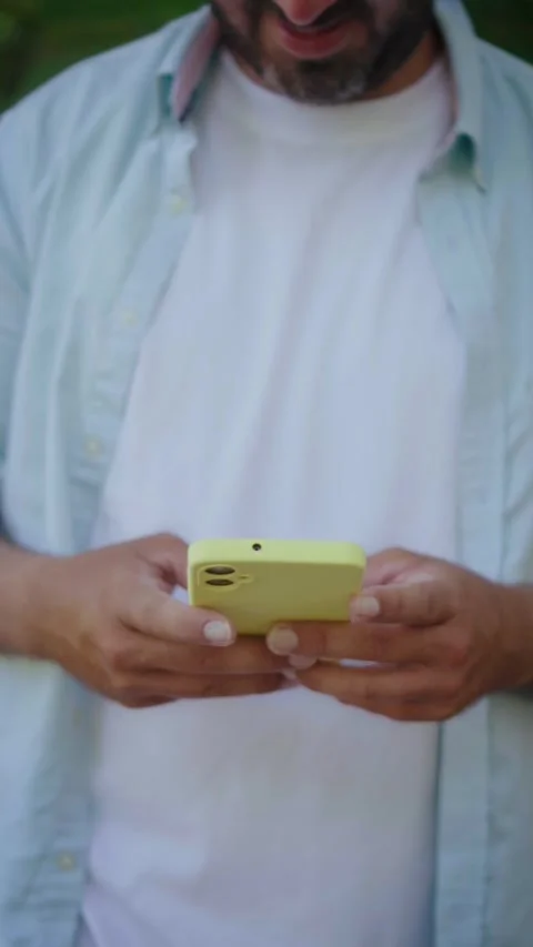Unrecognizable man texting on modern smartphone Stock Footage 337905722