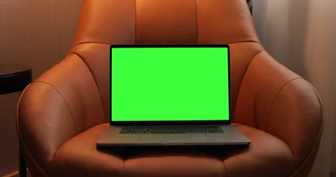Unrecognizable man turning off and shut down a laptop with pre keyed green scree Stock Footage 140250844