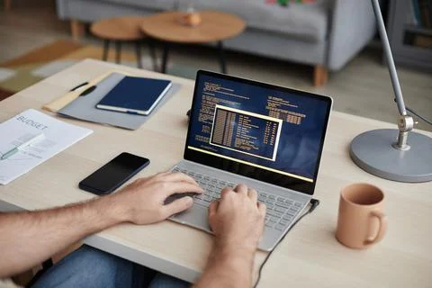 Unrecognizable Man Typing at Computer Keyboard and Writing Code Stock Photos