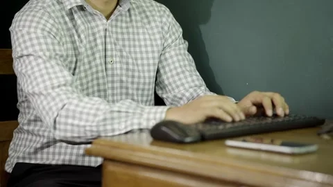 Unrecognizable Man typing at his desk, office job Video stock 275349469