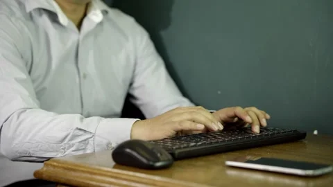 Unrecognizable Man typing at his desk, office job Video stock 275349470