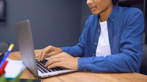 Unrecognizable man using computer Stock Footage 104838121