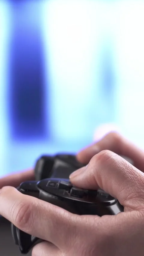 Unrecognizable man using a controller while playing Stock-Footage 334716463