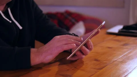 Unrecognizable man using digital tablet at home Stock Footage 167362960