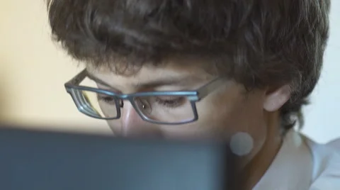Unrecognizable man using a modern portable computer on an outdoor table, street Video stock 65376830