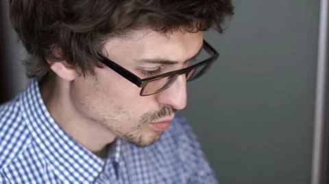 Unrecognizable man using a modern portable computer on an outdoor table, street Stock Footage 65378469