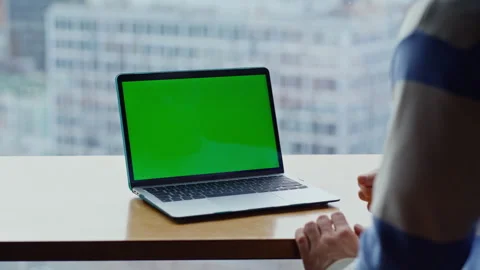 Unrecognizable man using touchpad at greenscreen at panoramic cafe. Ceo working Stock Footage 335246805