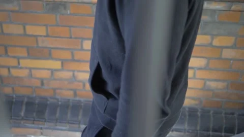 Unrecognizable man walks down some stairs in slow motion Stock Footage 229410622