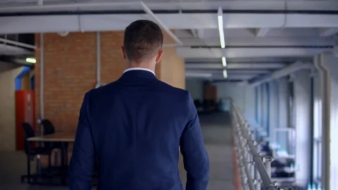 Unrecognizable man walks indoors Stock Footage 101478293