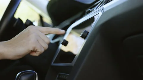 Unrecognizable man which typing needed coordinates on navigator touchscreen Stock Footage 194752573