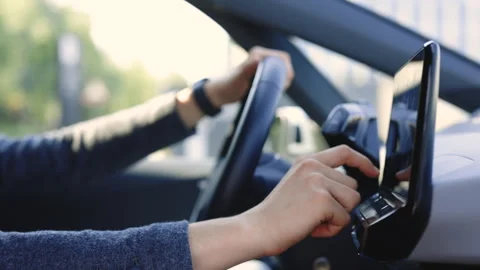 Unrecognizable man which typing needed coordinates on navigator touchscreen Stock Footage 248908357