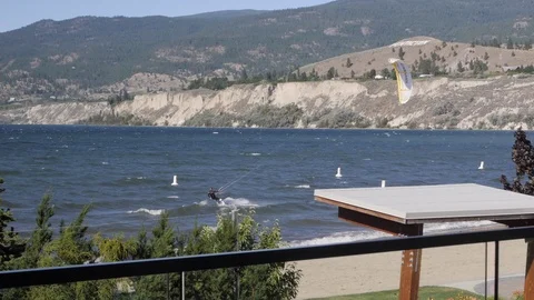 Unrecognizable man wind surfing on rough water	 Video stock 122587924