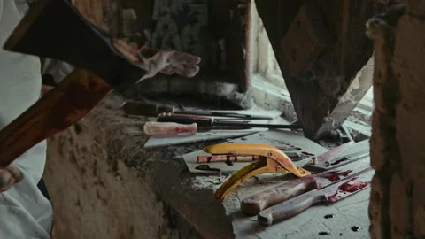 Unrecognizable Maniac Choosing Axe from Instruments to Commit Murder Stock Footage 250946490