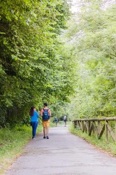 Unrecognizable mixed race mid couple ecotourism hiking in senda del oso Stock Photos