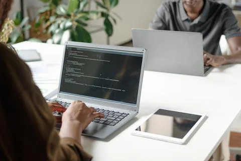 Unrecognizable Office Workers Writing Codes Stock Photos
