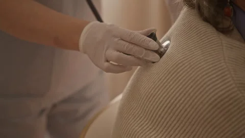 Unrecognizable Paramedic Performing Auscultation Stock Footage 335879611