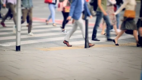 Unrecognizable pedestrians on the street.  Stock Footage 85708328