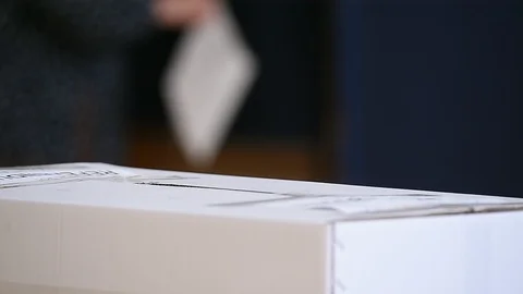 Unrecognizable people casting their votes inside voting booths during elections 스톡 동영상 119657072