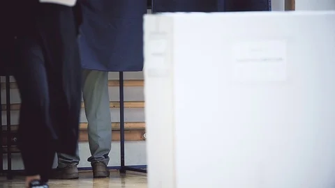 Unrecognizable people casting their votes inside voting booths during elections 스톡 동영상 119657317