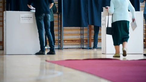 Unrecognizable people casting their votes inside voting booths during elections 스톡 동영상 119657466
