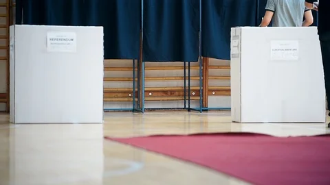 Unrecognizable people casting their votes inside voting booths during elections 스톡 동영상 119657496