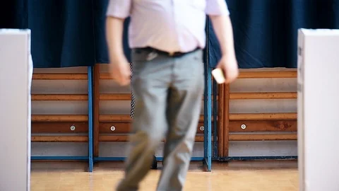 Unrecognizable people casting their votes inside voting booths during elections 스톡 동영상 119657518