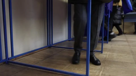 Unrecognizable people casting their votes during election day 스톡 동영상 294087620