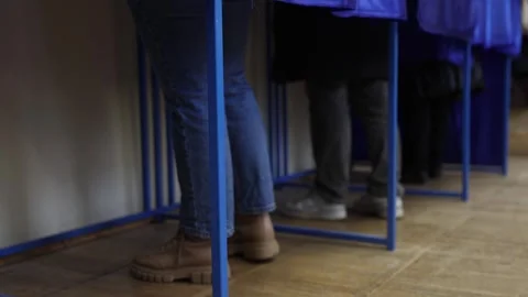 Unrecognizable people casting their votes during election day 스톡 동영상 294087621