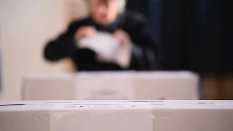 Unrecognizable people casting votes into the ballot box during elections 스톡 동영상 70520954
