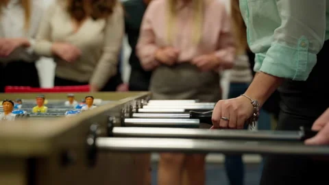 Unrecognizable people emotional play table football soccer closeup 4K Stock Footage 162549097