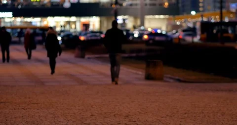 Unrecognizable people on the sidewalk. Evening n Warsaw. Video stock 86569013