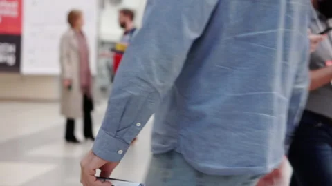 Unrecognizable people walking past the camera. Stock Footage 166560416
