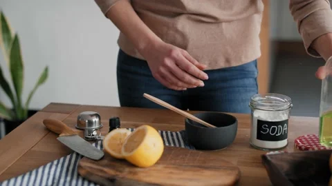 Unrecognizable person adding soap to the bowl with DIY cleaning product Stock-Footage 172567030