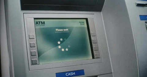 Unrecognizable Person Entering PIN Code. Error Message on Cash Machine Due to Stock Footage 310119139