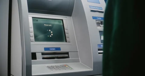 Unrecognizable Person Entering PIN Code. Error Message on Cash Machine Due to Stock Footage 310120388