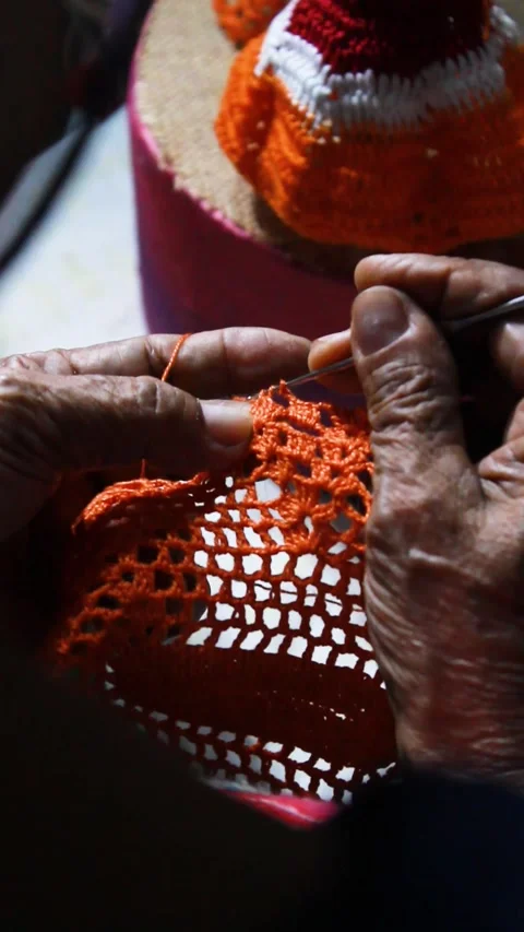 An unrecognizable person knitting with wool Stock Footage 303648217