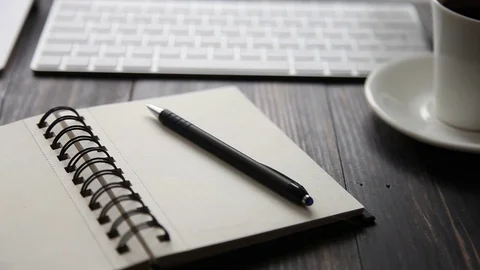 Unrecognizable person makes notes in the dairy Stock Footage 71454377