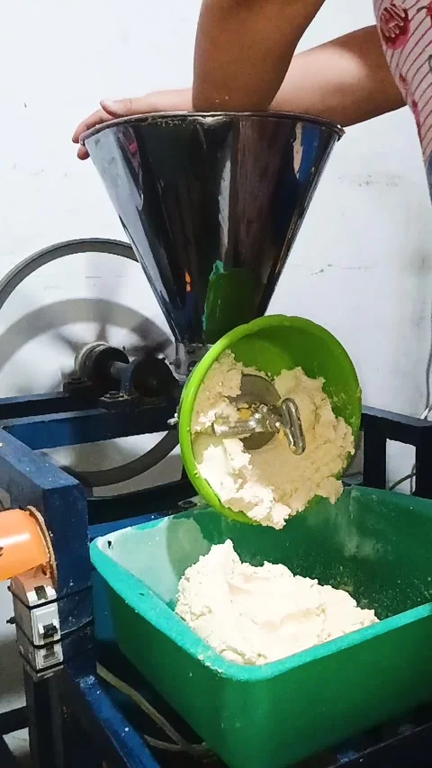 An unrecognizable person mixing corn in a mill Stock Footage 304297201