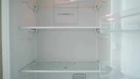 Unrecognizable Person Opens the Empty Refrigerator. Poverty and Economic Crisis Stock Footage 156132737