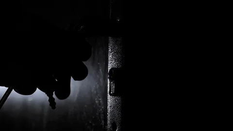 An Unrecognizable Person Opens a Keyhole With a Key and Opens the Door in a Dark Видео 128338840
