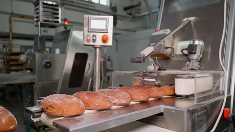 Unrecognizable person put bread on Assembly line. Slow motion Stock Footage 250273826