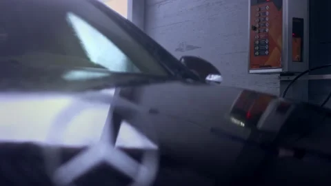 Unrecognizable person uses a high pressure jet water to wash off the foam and Stock Footage 145545221