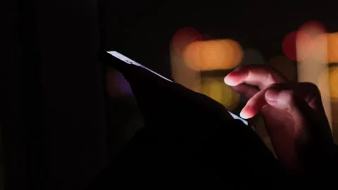 Unrecognizable person uses smartphone at the window. Stock-Footage 276970815