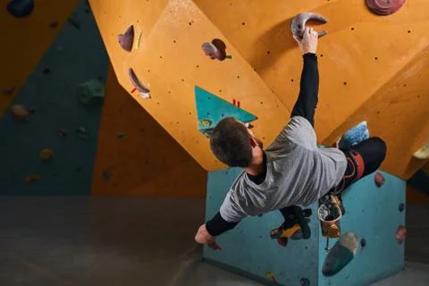 Unrecognizable physically challenged man finishing bouldering training Stock Photos
