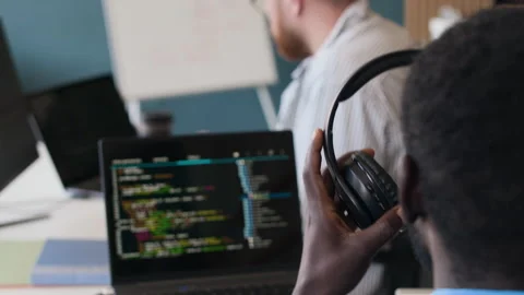 Unrecognizable Programmer Putting On Headphones Stock Footage 283214959