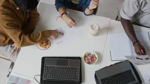 Unrecognizable Programmers Looking at Documents Stock-Footage 317345229