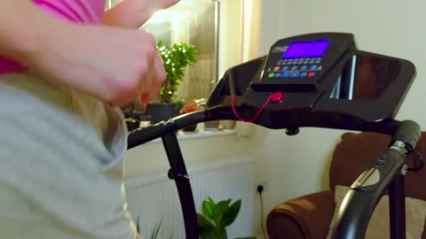 Unrecognizable runner exercising on treadmill slow motion during indoor cardio Stock Footage 333245965