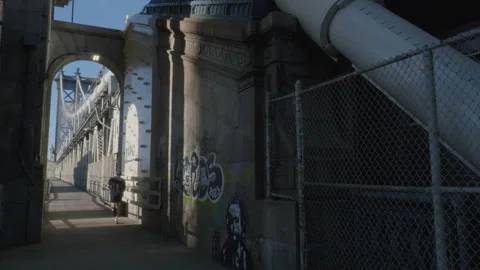 Unrecognizable runner on The Manhattan Bridge Stock Footage 269110239