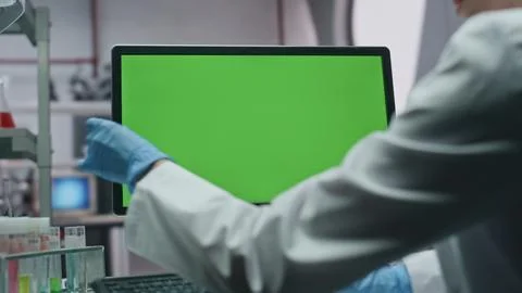 Unrecognizable scientist working mockup computer in modern laboratory closeup Foto stock