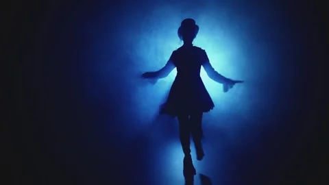 Unrecognizable silhouette walking dancing in top hat. fog dark city street night Stock Footage 317260261